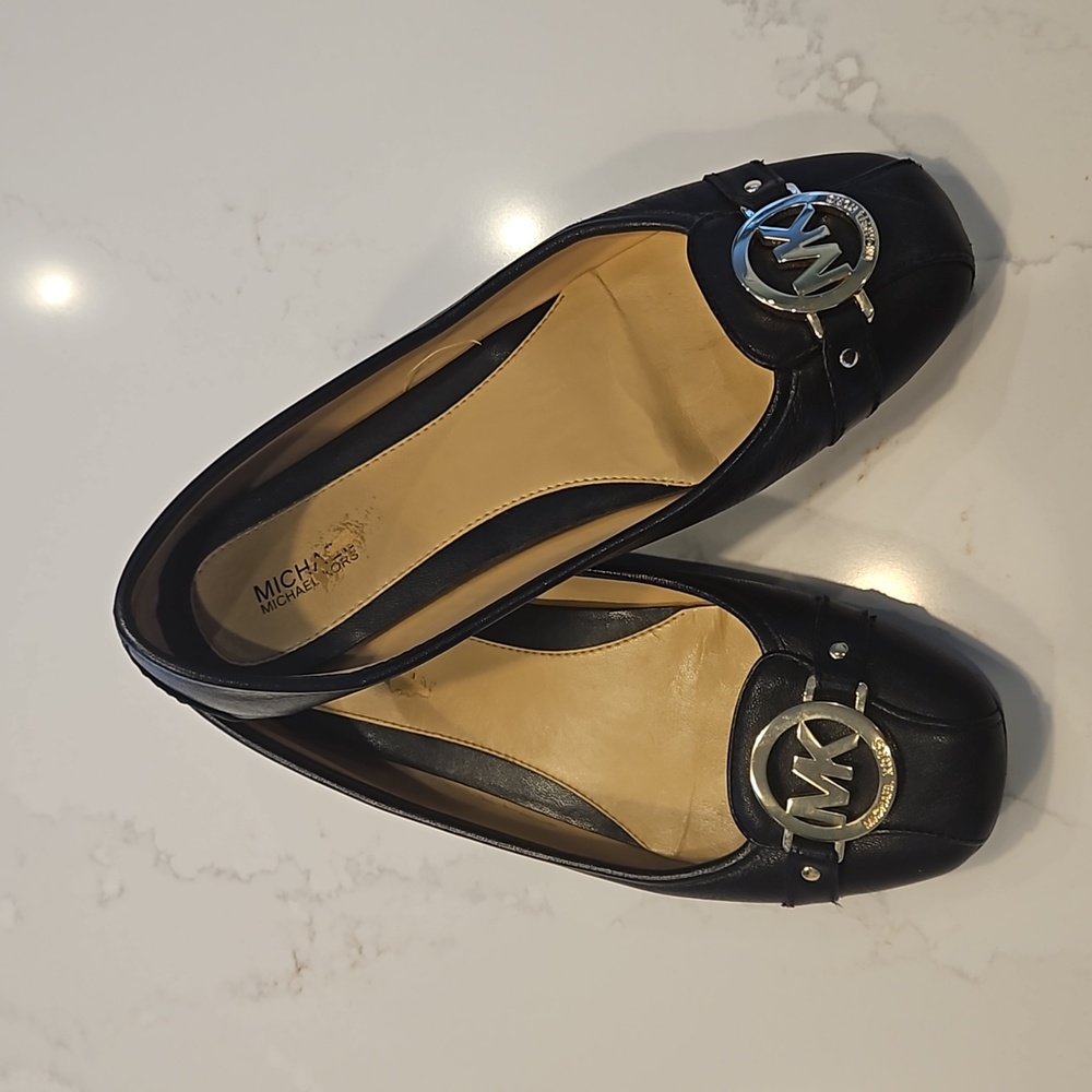 Michael Kors black Signature Ballet Flats with gold emblem. Size 8M.